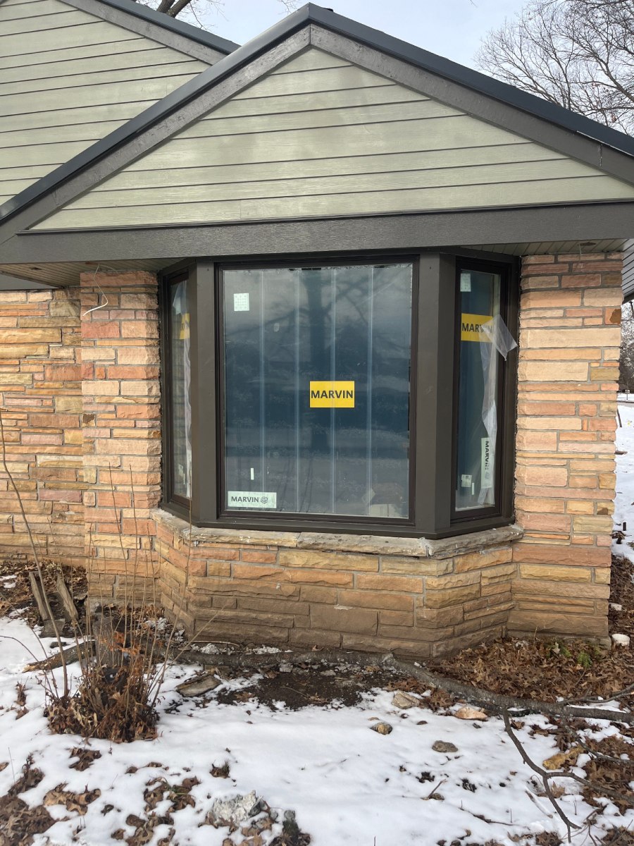 Close-up of bay window with Marvin sticker